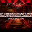 Red-lit restaurant interior with a long table, statues at sides, used as a hero image for Medellín private-dining article text overlay.